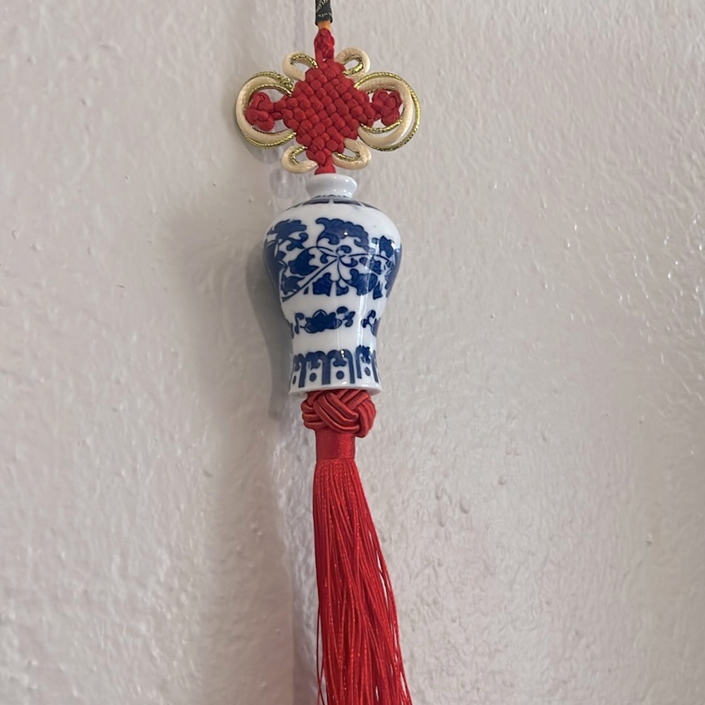 Red tasseled ornament with blue china vase bead